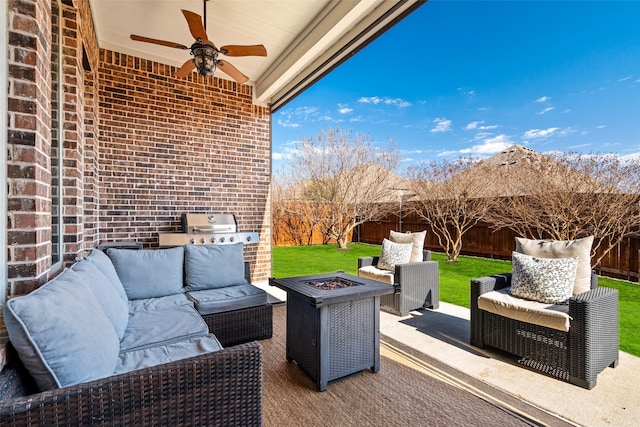 view of patio featuring an outdoor living space with a fire pit, a grill, a fenced backyard, and ceiling fan