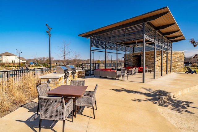 view of patio with an outdoor kitchen and outdoor lounge area