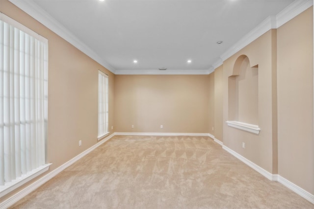 carpeted empty room with crown molding