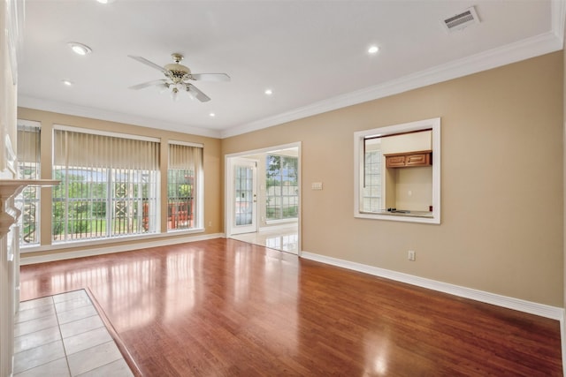 unfurnished living room with ornamental molding, light hardwood / wood-style floors, and ceiling fan