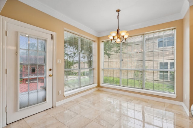 unfurnished dining area with ornamental molding and an inviting chandelier