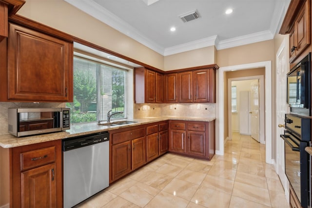 kitchen featuring sink, backsplash, light stone counters, black appliances, and crown molding