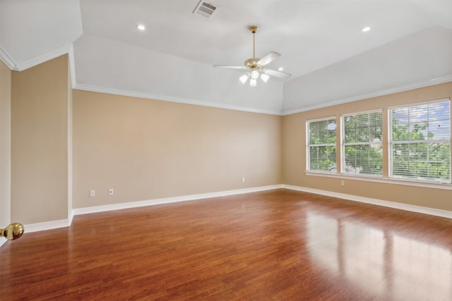 spare room with vaulted ceiling, ceiling fan, crown molding, and hardwood / wood-style floors