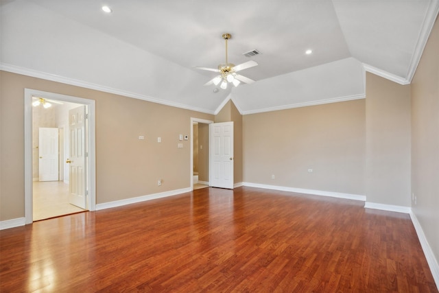 spare room featuring crown molding, ceiling fan, and vaulted ceiling