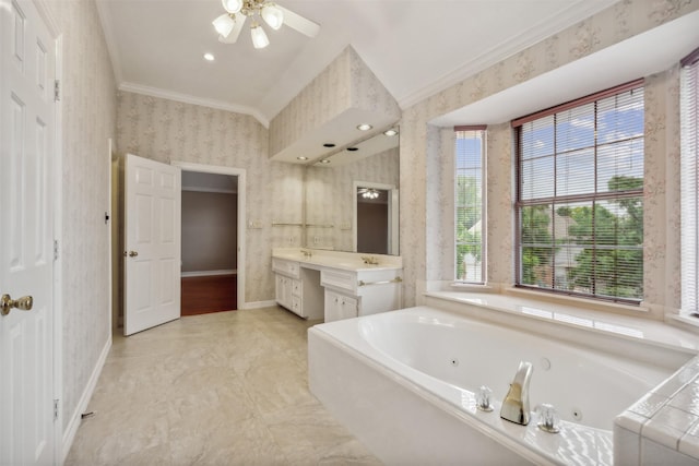 bathroom with ceiling fan, ornamental molding, vanity, and a washtub