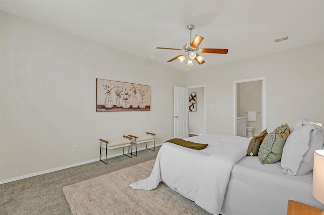 bedroom featuring carpet flooring, ceiling fan, and ensuite bath