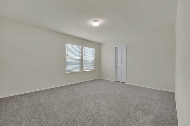 empty room with light colored carpet