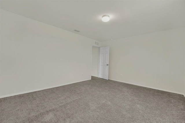 spare room featuring carpet