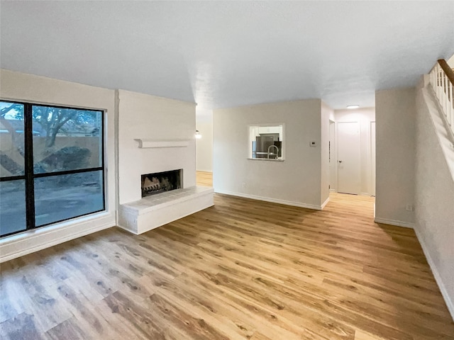 unfurnished living room with light hardwood / wood-style flooring