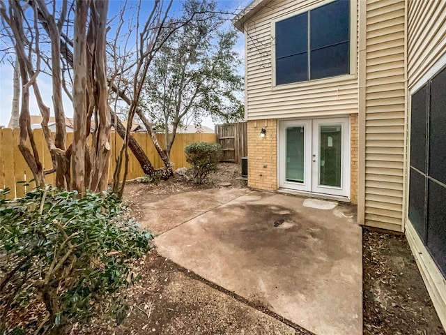 view of patio / terrace with french doors and central air condition unit