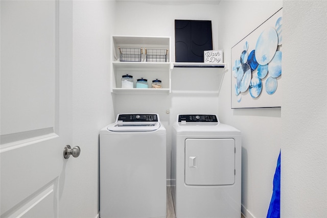 laundry area with washer and clothes dryer