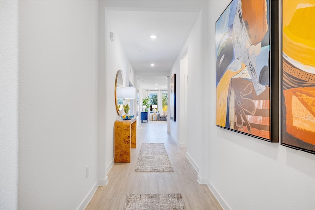 corridor featuring light hardwood / wood-style floors