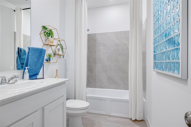 full bathroom featuring shower / bathtub combination with curtain, vanity, wood-type flooring, and toilet