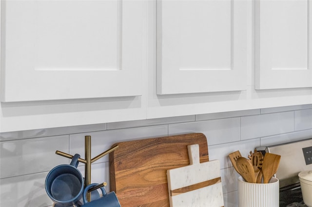 details featuring white cabinetry