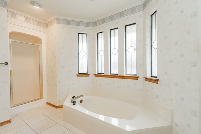 bathroom with a healthy amount of sunlight, tile patterned floors, and shower with separate bathtub