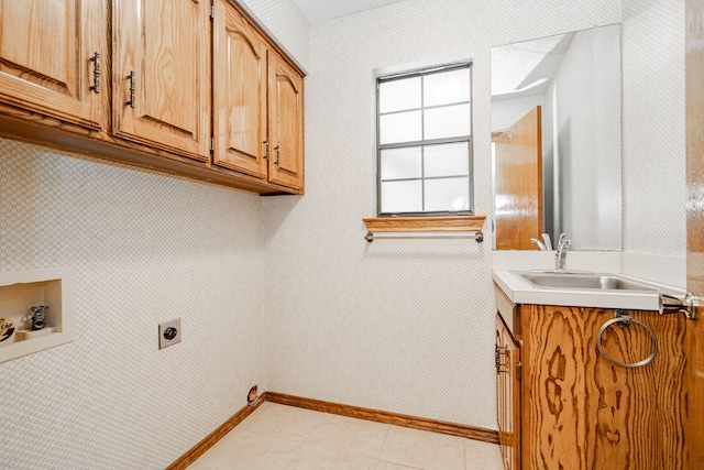 washroom featuring sink, cabinets, light tile patterned floors, hookup for a washing machine, and electric dryer hookup