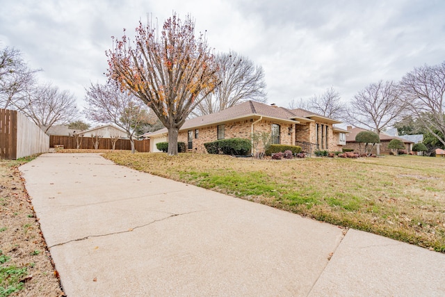 view of property exterior featuring a lawn