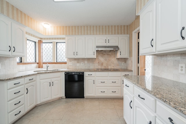 kitchen with white cabinets, light stone countertops, sink, and black appliances