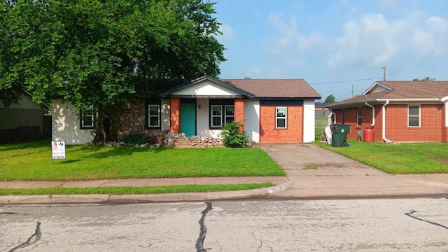 bungalow-style home featuring a front lawn