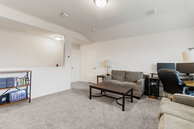 living room with light colored carpet and lofted ceiling