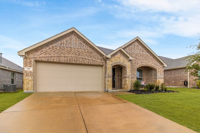 view of front of house featuring a garage and a front yard