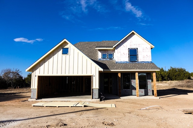 view of front facade with a porch and a garage