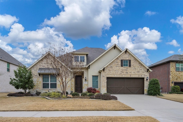 view of front of house with a garage and a front lawn