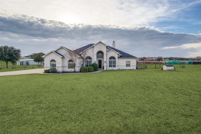 ranch-style house with a front yard