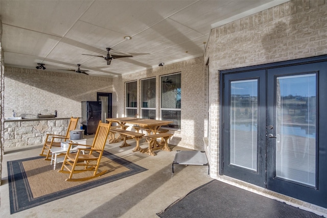 view of patio with french doors and ceiling fan