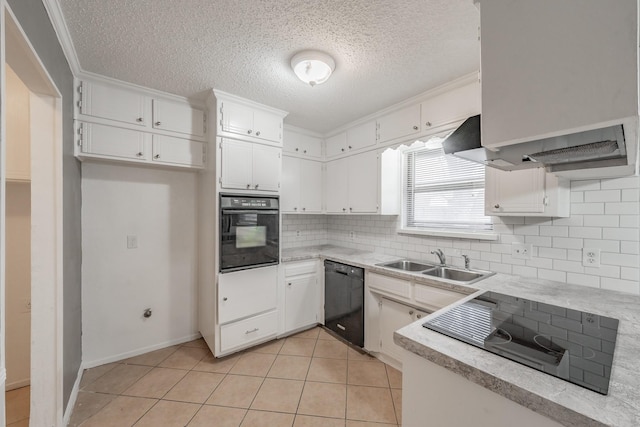 kitchen featuring white cabinetry, backsplash, sink, and black appliances