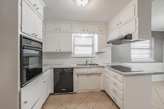 kitchen featuring sink, black appliances, light tile patterned floors, kitchen peninsula, and white cabinets