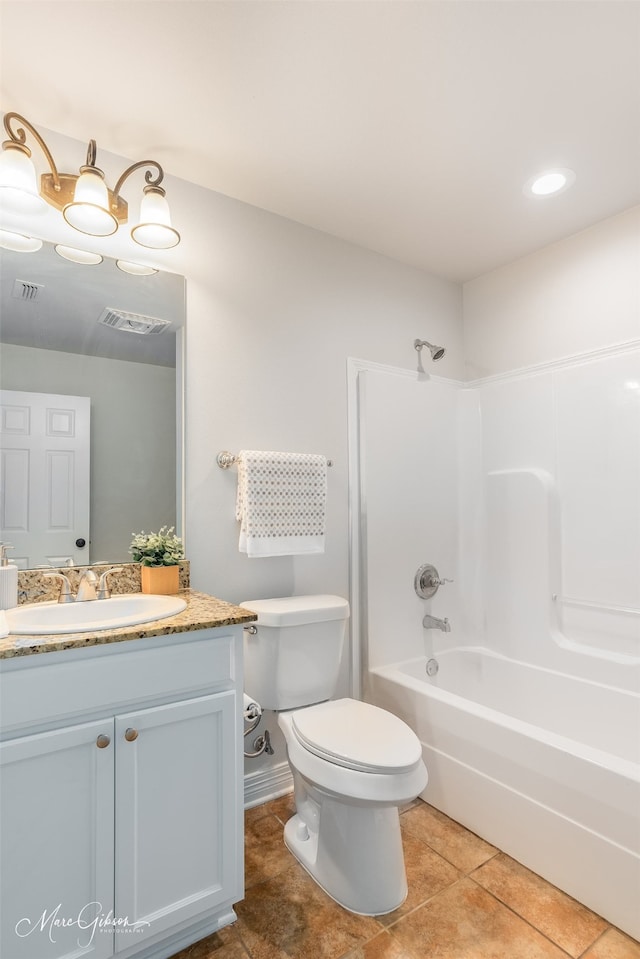 full bathroom with tile patterned floors, toilet, shower / bath combination, and vanity