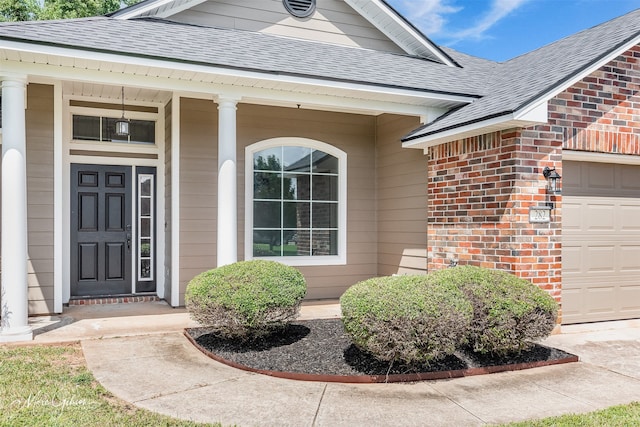 property entrance with a garage