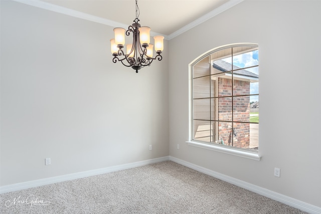 carpeted empty room featuring crown molding and a notable chandelier