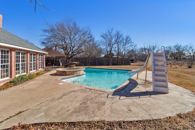 view of pool featuring an in ground hot tub, a patio, and a water slide