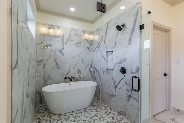 bathroom featuring shower with separate bathtub and tile walls