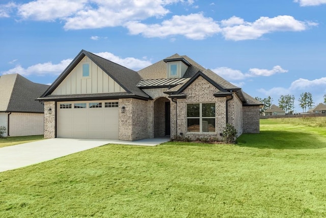 view of front of home featuring a garage and a front lawn