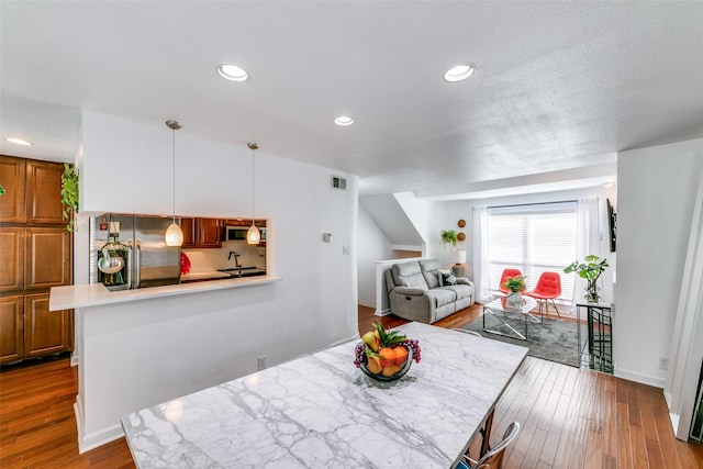 dining space featuring hardwood / wood-style floors