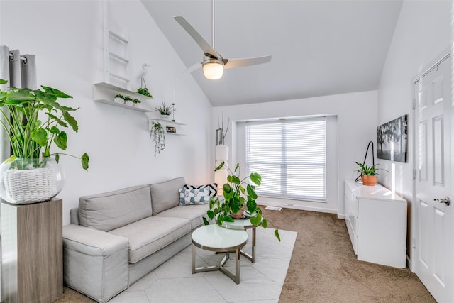 living room featuring vaulted ceiling, light carpet, and ceiling fan