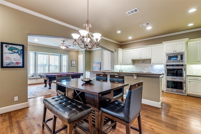 dining room with crown molding, pool table, ceiling fan, and light hardwood / wood-style flooring