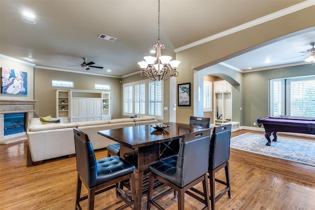 dining room with crown molding, billiards, ceiling fan, and light wood-type flooring