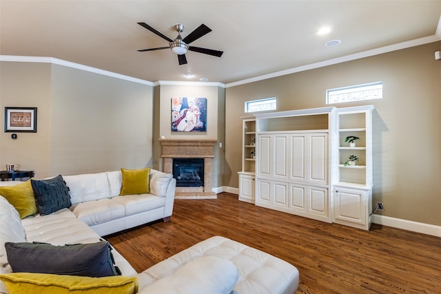 living room with crown molding, dark hardwood / wood-style floors, and ceiling fan