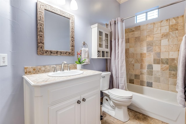 full bathroom featuring vanity, toilet, and shower / bath combo with shower curtain