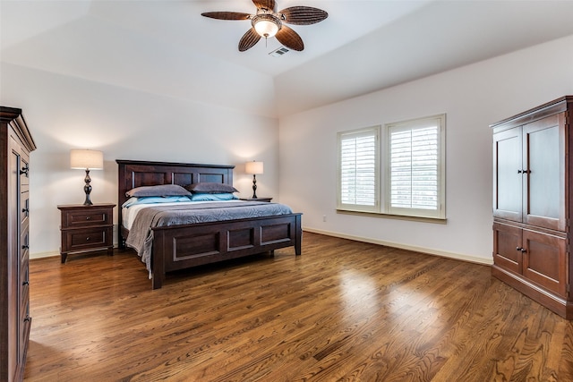 bedroom featuring vaulted ceiling, dark wood-type flooring, and ceiling fan