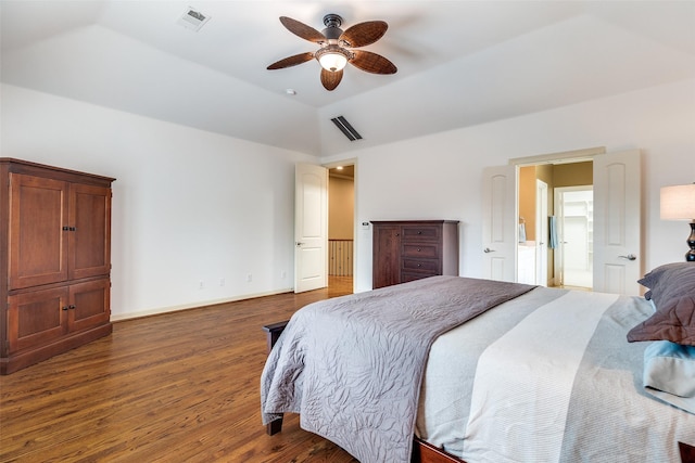 bedroom featuring ceiling fan, dark hardwood / wood-style flooring, and vaulted ceiling