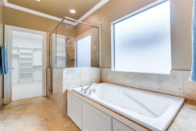 bathroom with ornamental molding, separate shower and tub, and tile patterned floors