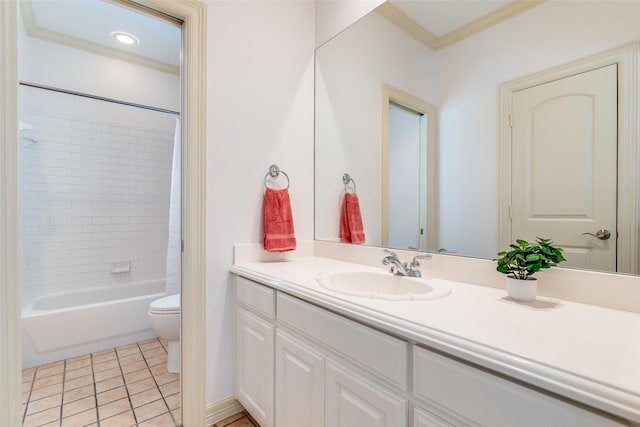 full bathroom featuring toilet, crown molding, vanity, tiled shower / bath combo, and tile patterned flooring