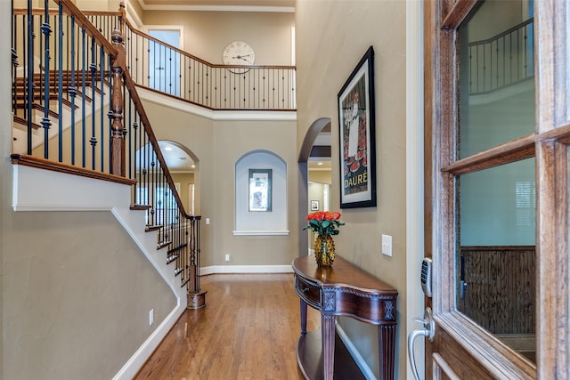 entrance foyer featuring a high ceiling and hardwood / wood-style floors