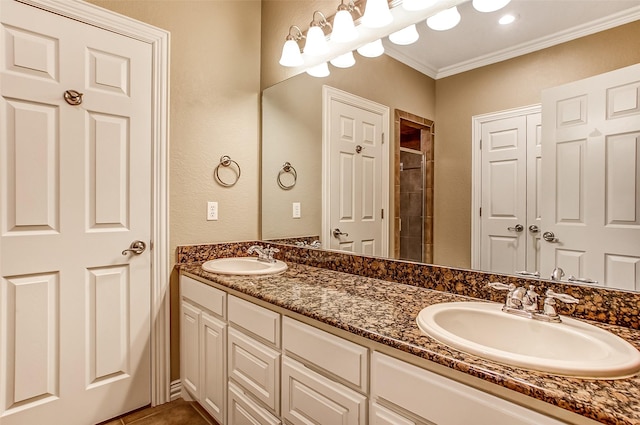 bathroom with vanity, tile patterned floors, ornamental molding, and a shower