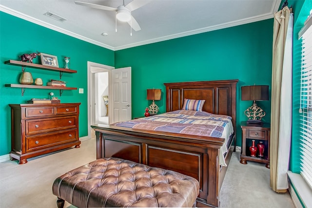 bedroom featuring ornamental molding, light carpet, and ceiling fan